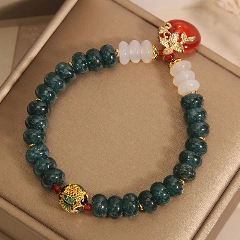 Blue water jade abacus bead crystal bracelet with red agate peace buckle and rhinestone details
