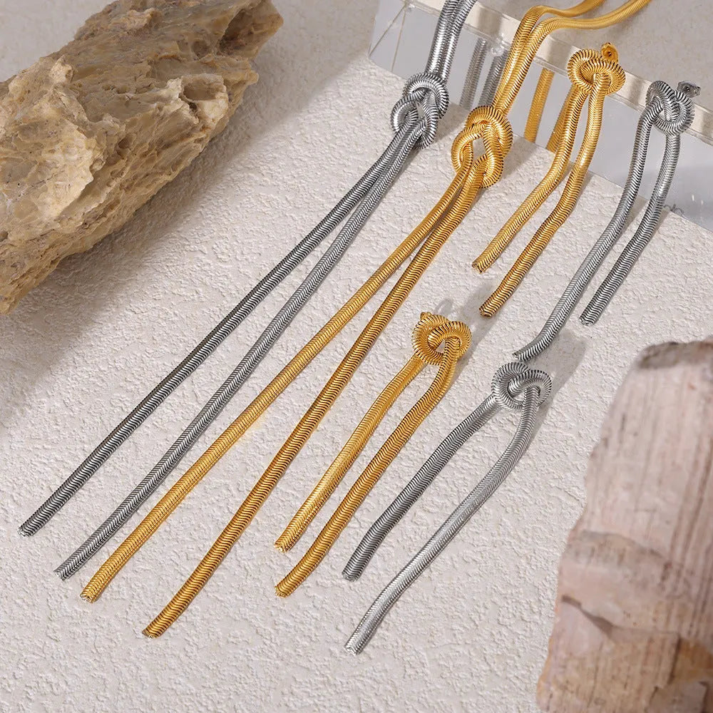 Gold knotted tassel pendant on snake chain necklace with matching earrings