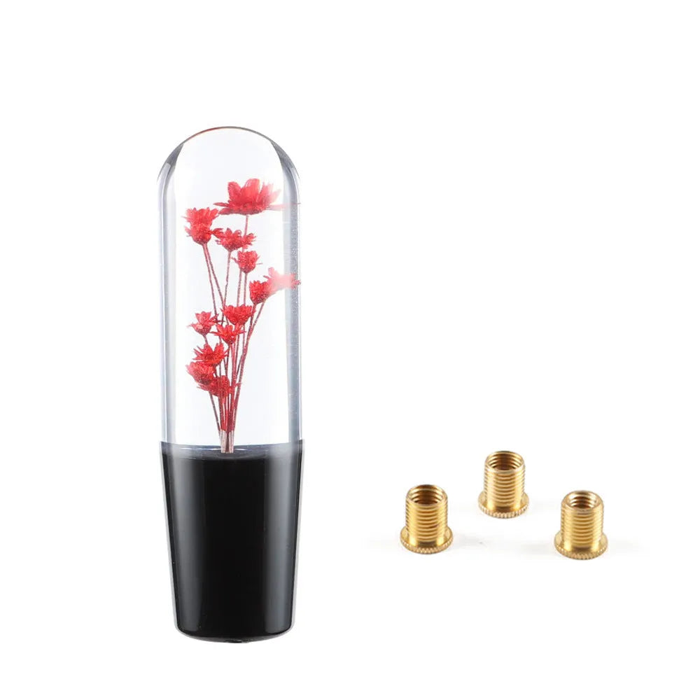 Transparent crystal car gear shift knob in assorted colours with three metal adapters.