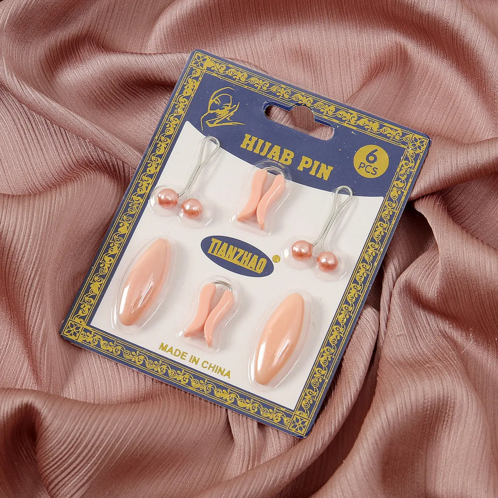 Plastic scarf clip with oval meander pattern and resin drip finish in five colours including black, gray, white, brown, and pink.