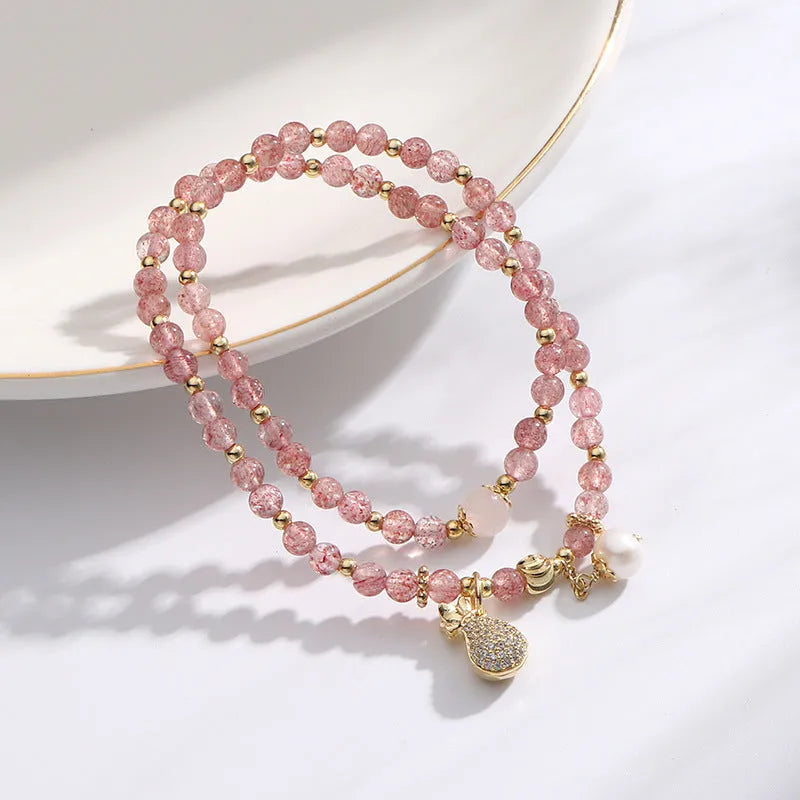 Women's geometric strawberry quartz crystal bracelet with adjustable fitting for money drawing