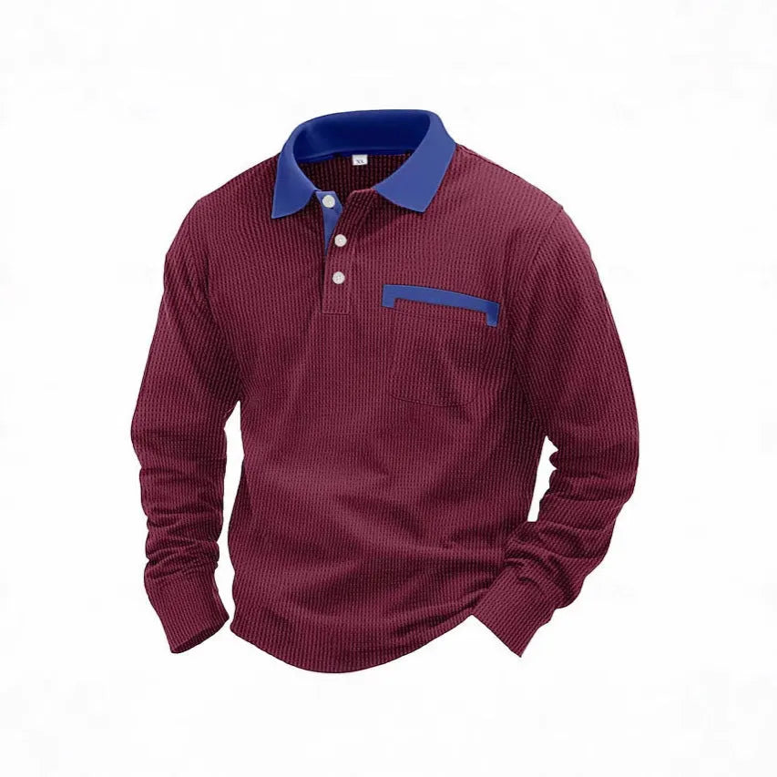 Man wearing a long-sleeved waffle knit polo shirt in a solid colour with an asymmetric design detail.