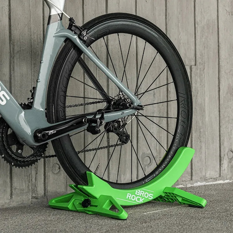 Black and green ABS plastic bicycle wall mount parking rack holder with fixed bracket.