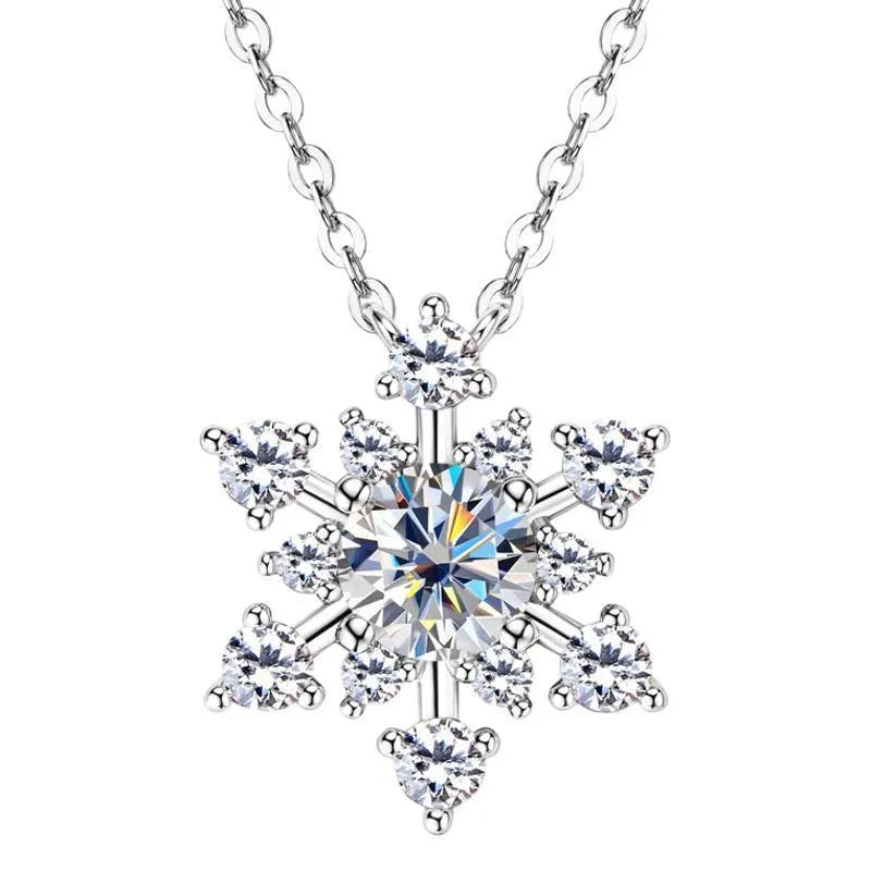 Gold snowflake moissanite pendant on silver 925 O-ring chain against white background