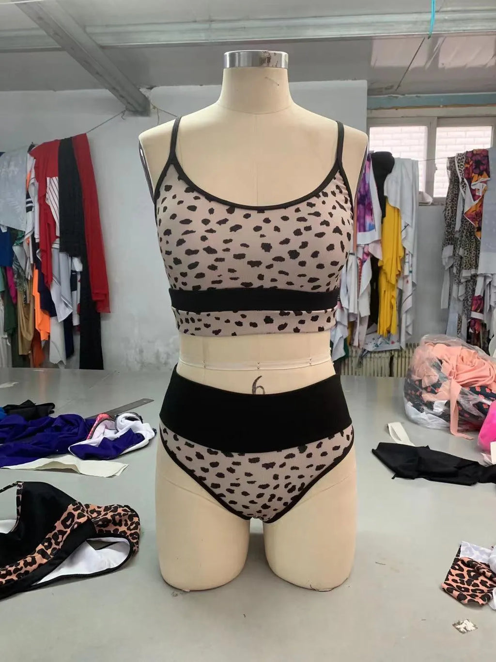 Women's high waist split bikini swimsuit in nylon fabric showing white and leopard print colour options