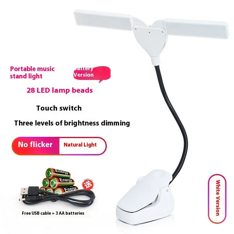 Black rechargeable music stand light with 28 LEDs clipped to metal music stand illuminating sheet music