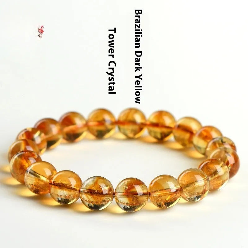 Natural yellow Asestelle citrine bracelet with hand-ground geometry beads on a wrist.