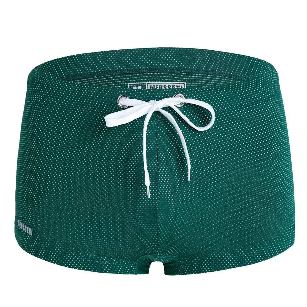 Men's low-waist boxer style swimming trunks with lace detailing in nylon fabric