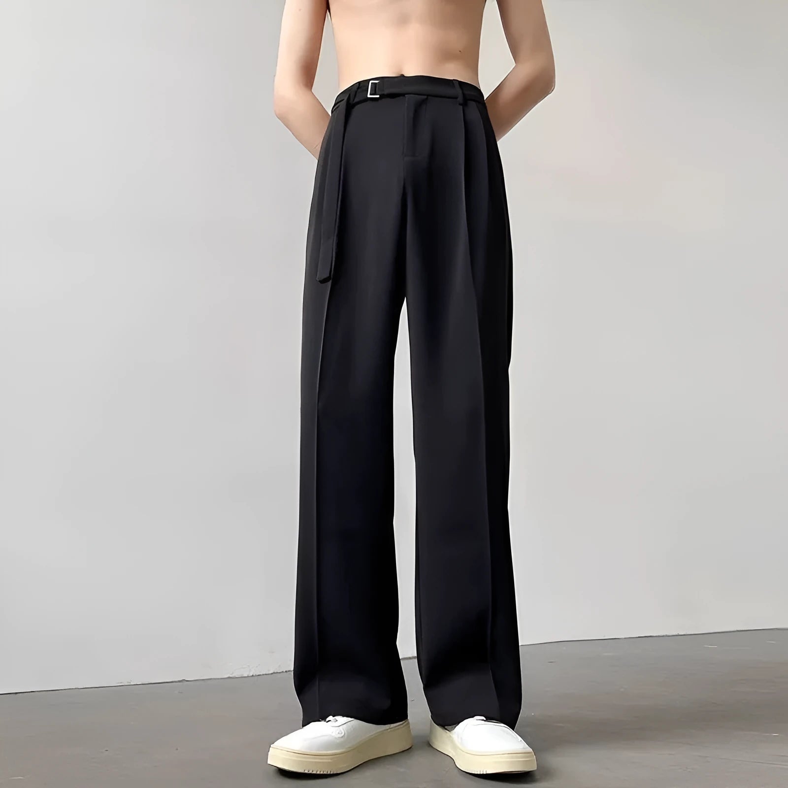 Black loose fit wide leg casual trousers with straight hem on a mannequin.