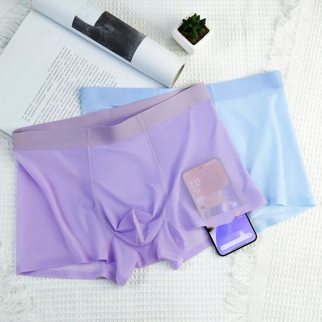 Men's ice silk boxer briefs in multiple colours on a white background, showing seamless design.