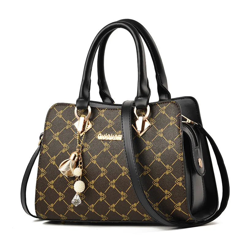 Women's geometric pattern print messenger bag in PU leather with zipper closure and internal organisers.