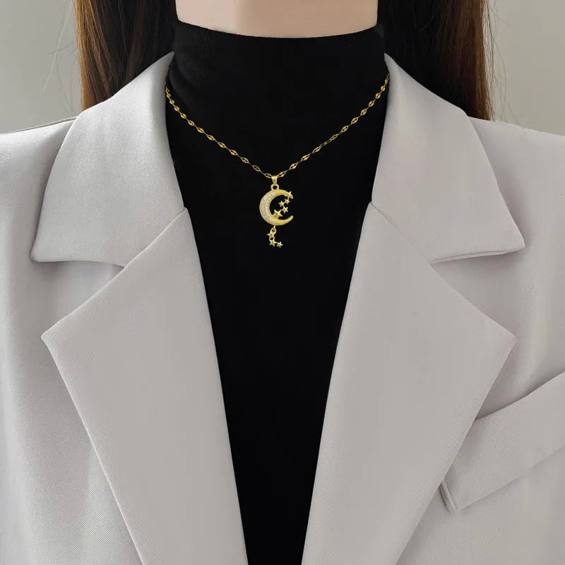 Stainless steel and copper moon pendant necklace with geometric diamond pattern and tassel design