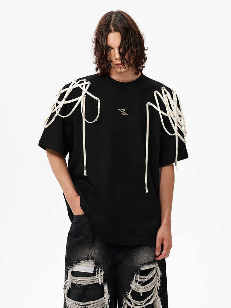 Black loose fit t-shirt with ribbon detailing on padded shoulders, short sleeves, round neck
