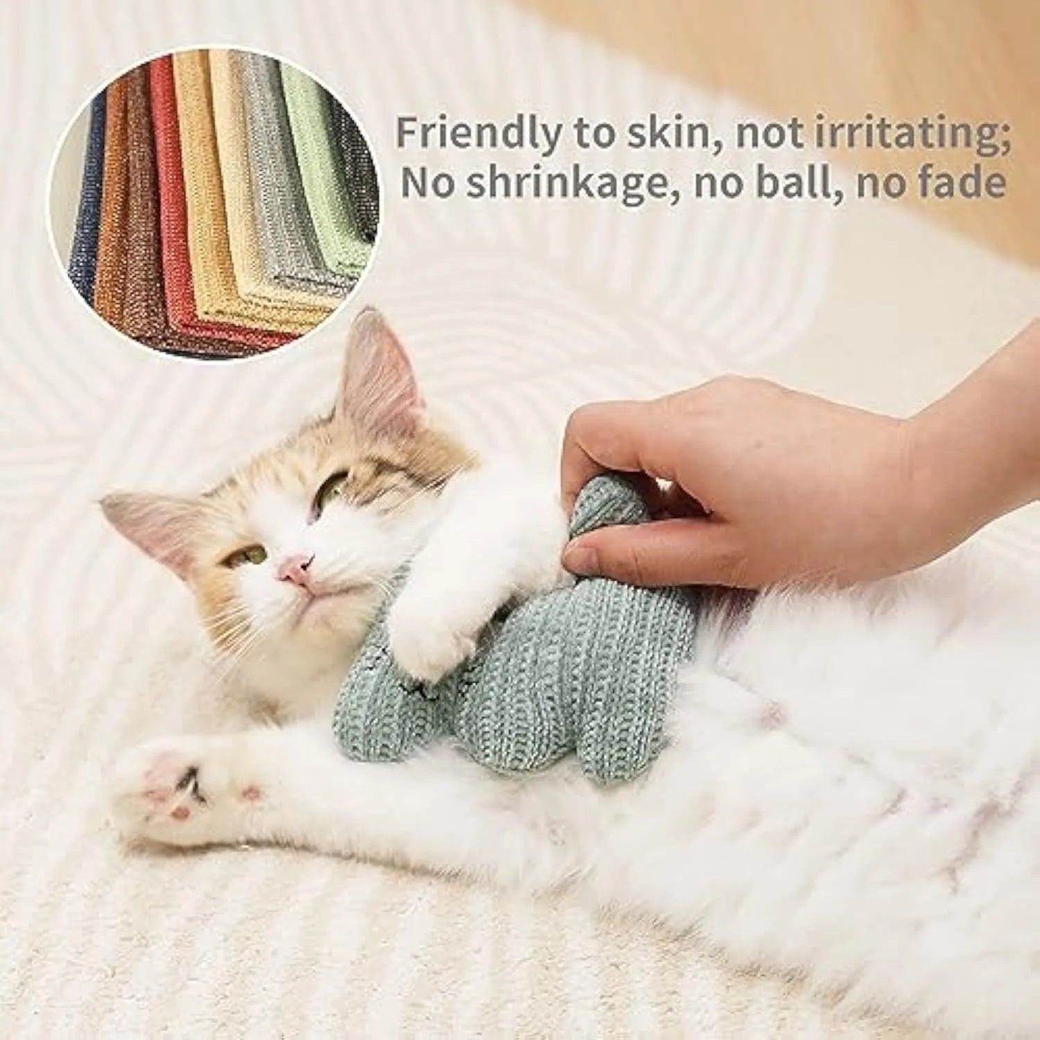 Cyan knitted plush cat toy with bell and organic catnip filling on a white background.