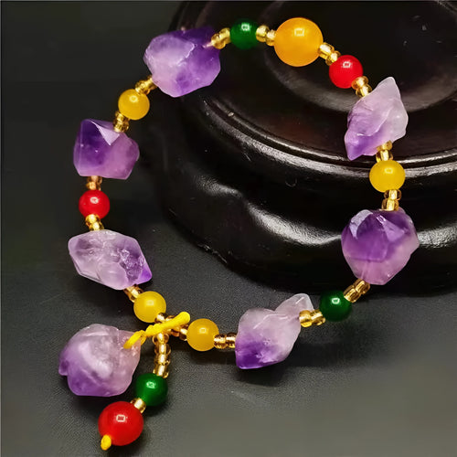 Women's amethyst bead bracelet with fu character charm and natural shaped beads