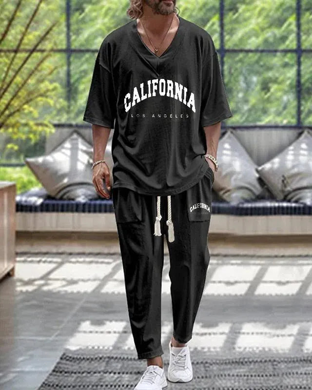 Man's thin polyester tracksuit set with V-neck cropped sleeve jacket and matching trousers