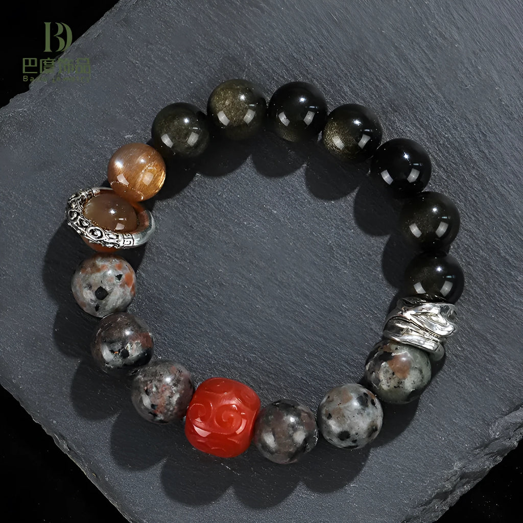 Gold obsidian flame stone red agate Wukong unisex bracelet on display showing natural stone beads