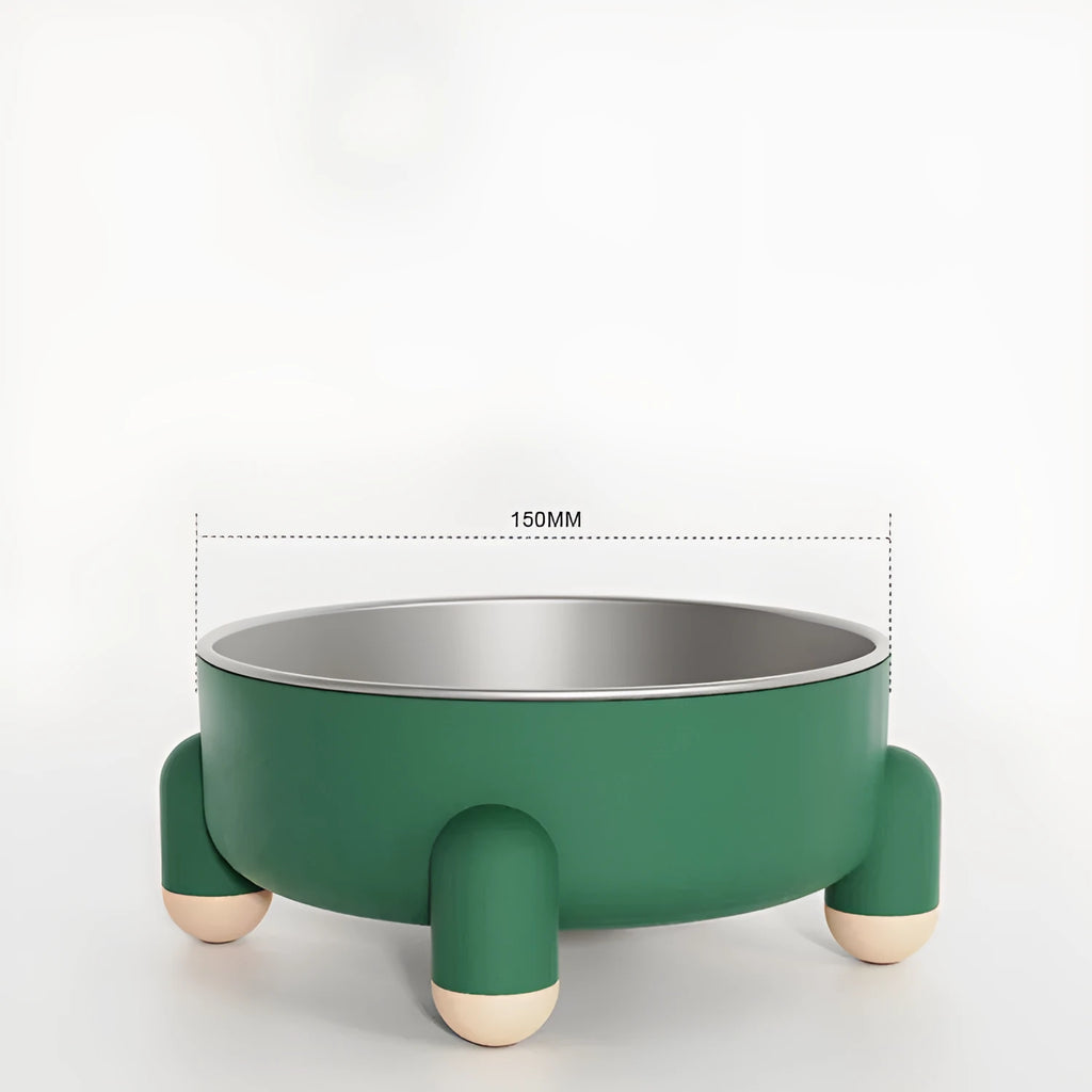 Green stainless steel pet bowl with a high foot and non-slip silicone base on a floor