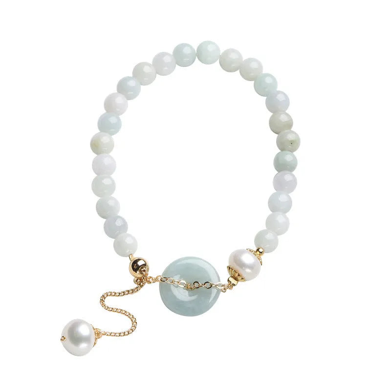 Natural emerald peace buckle pearl bracelet for women with jade round pendant on a geometric design.