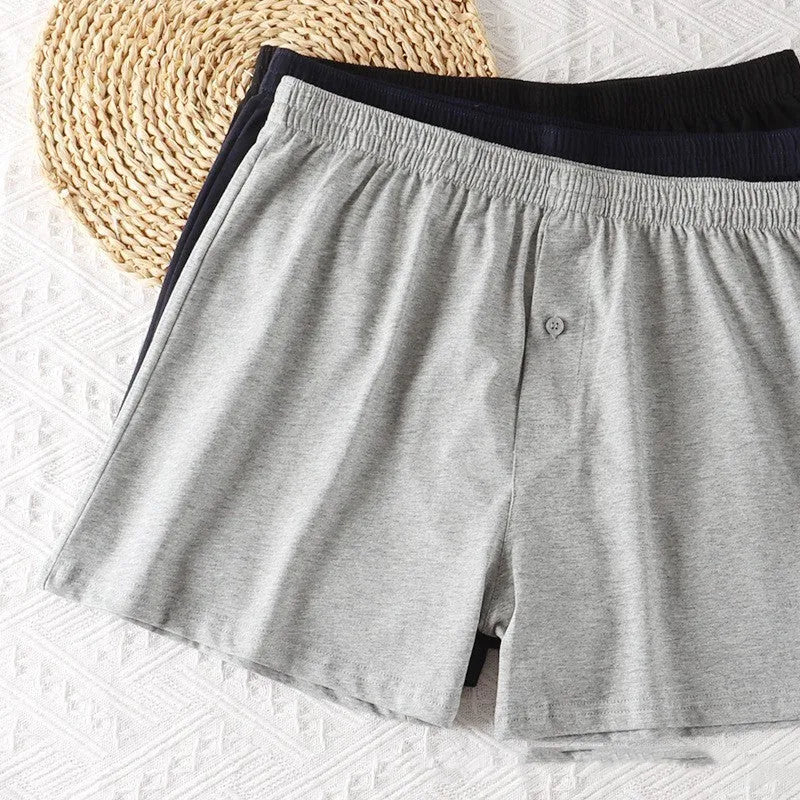 Men's light grey cotton boxer shorts with high waist and loose fit design