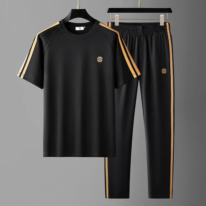Men's blue ice silk style short sleeve suit set with top and pants for sports.