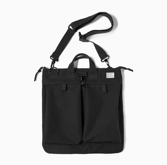 Marden Tooling medium canvas messenger bag in charcoal black with a shoulder strap and hard handle.