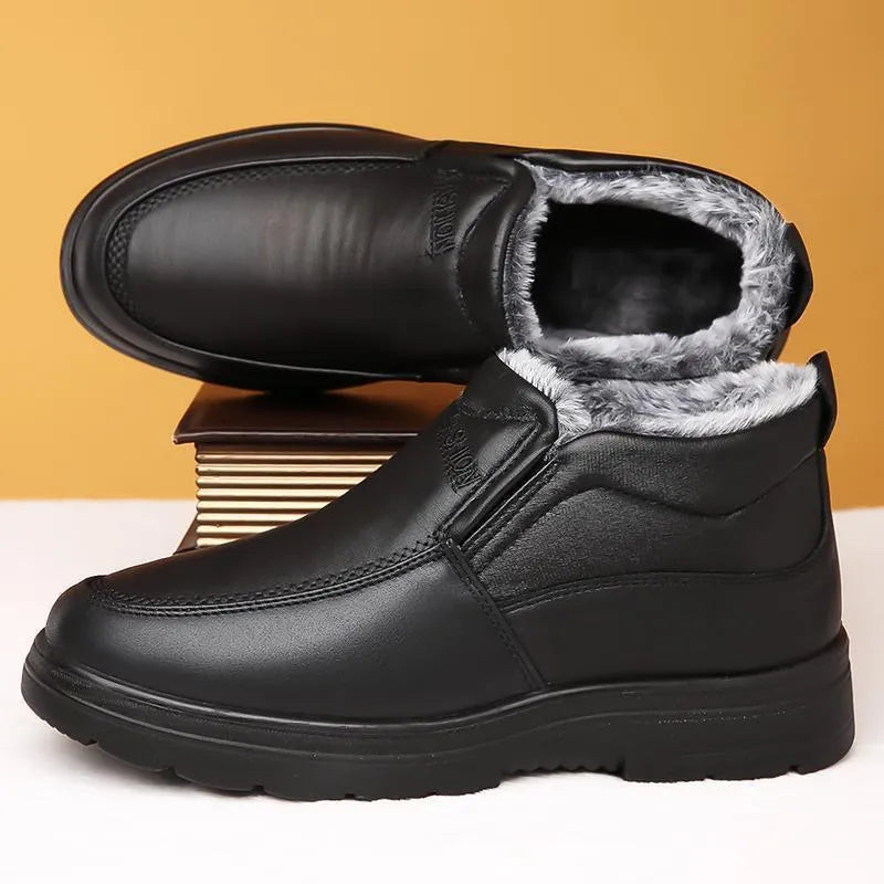 Men's black winter slip-on shoes with fleece lining and rubber sole on grey background