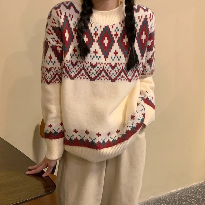 Red and white striped loose retro-style long sleeve pullover knitted top on a hanger.