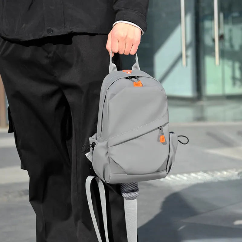 Men's black waterproof polyester crossbody bag with single shoulder strap and simple casual design