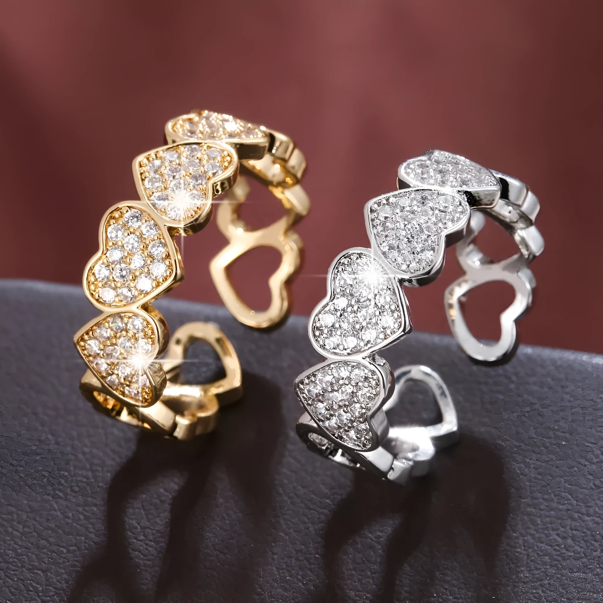 Geometric adjustable opening couples ring with heart design in gold or silver colour.