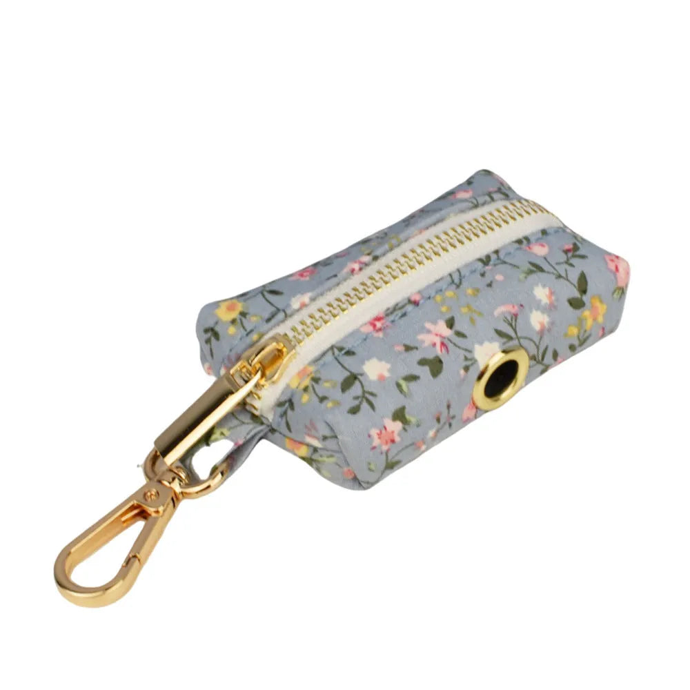 Floral pattern dog collar set with leash, vest, bow, and poop bag holder in five coordinated pieces