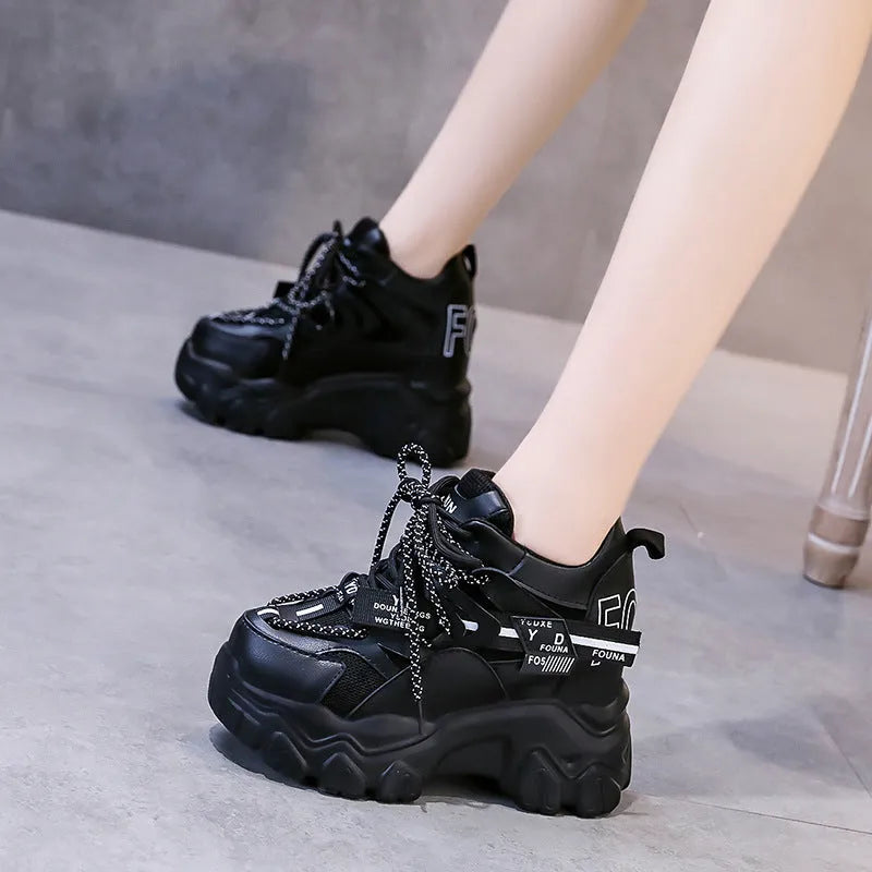 Women's white breathable mesh platform sports shoes with cross strap and rubber sole.