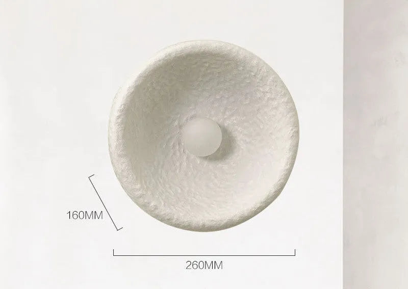 Japanese-style minimalist resin wall lamp in warm light, showing size options.