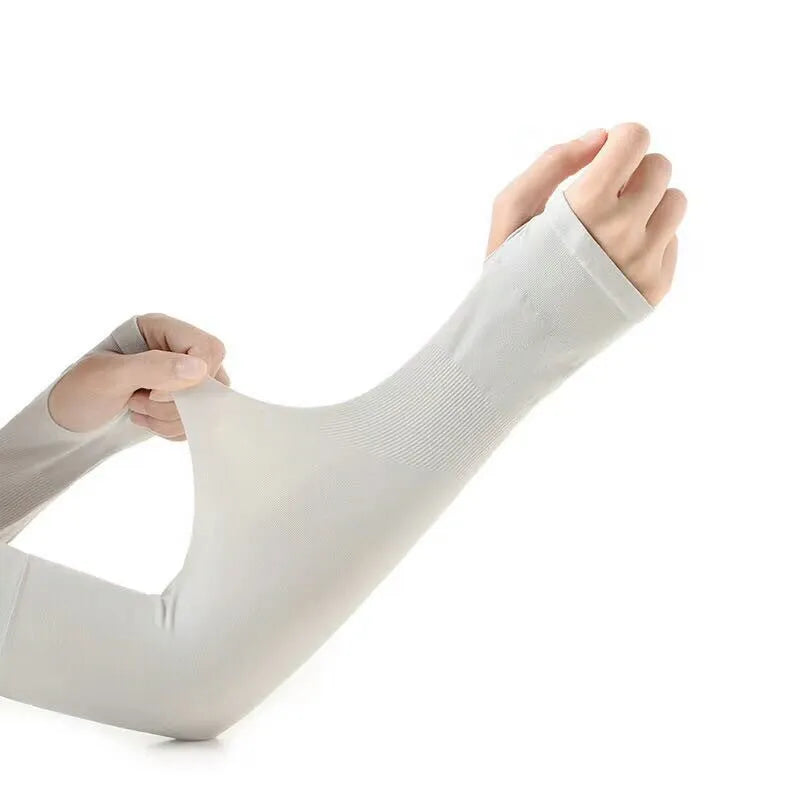 Unisex black sun protection driving sleeve with open finger design on an arm.