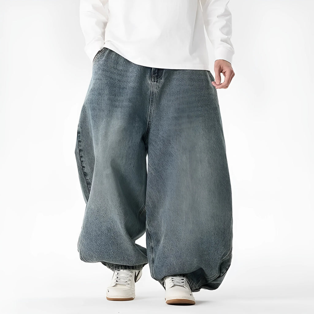 Men's plus size baggy jeans in dark blue denim with a straight leg and low waist.