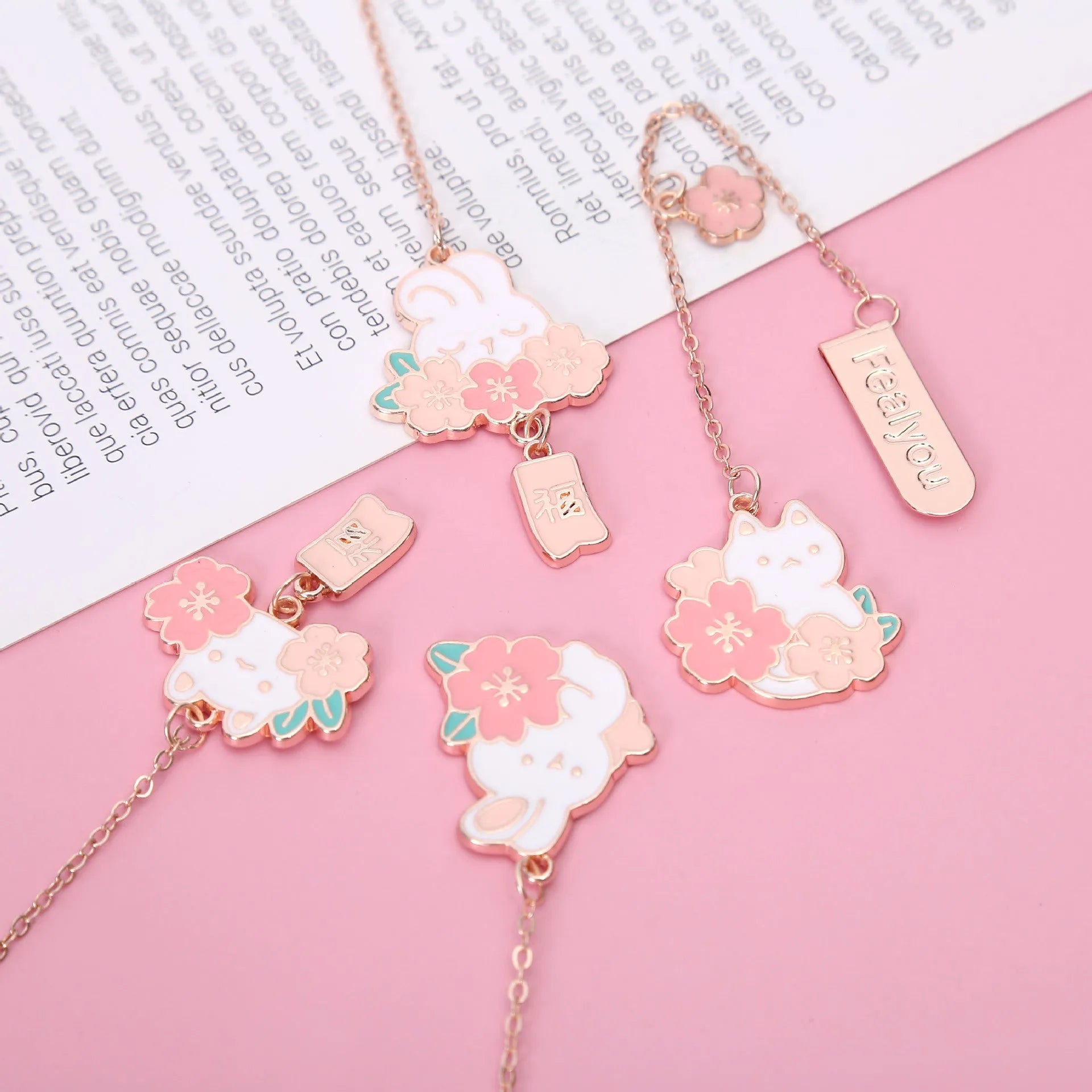 Creative cartoon metal pendant bookmark holder with cherry cat design.
