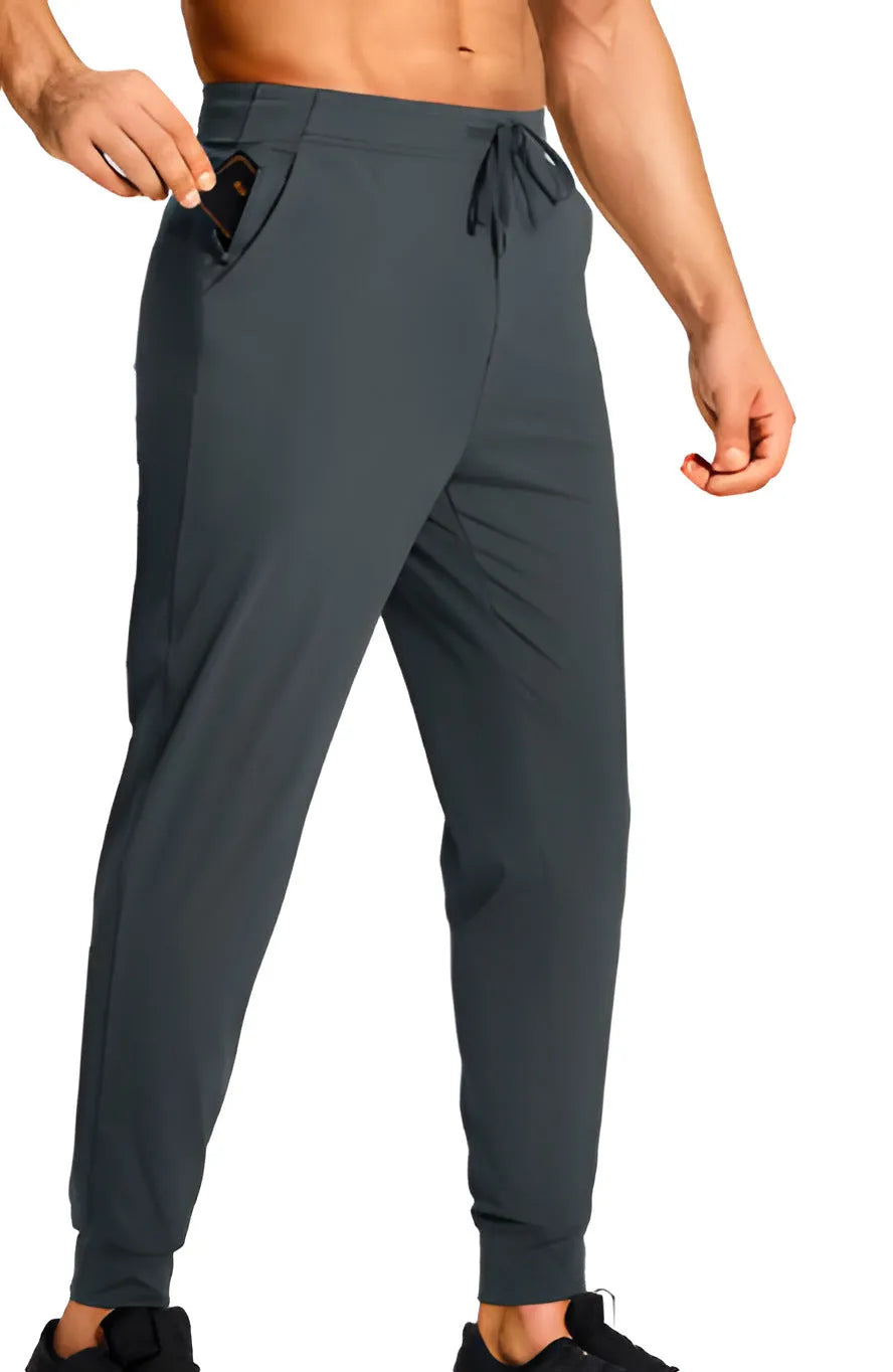 Men's loose-fit solid colour casual trousers made from polyester fabric on a hanger.