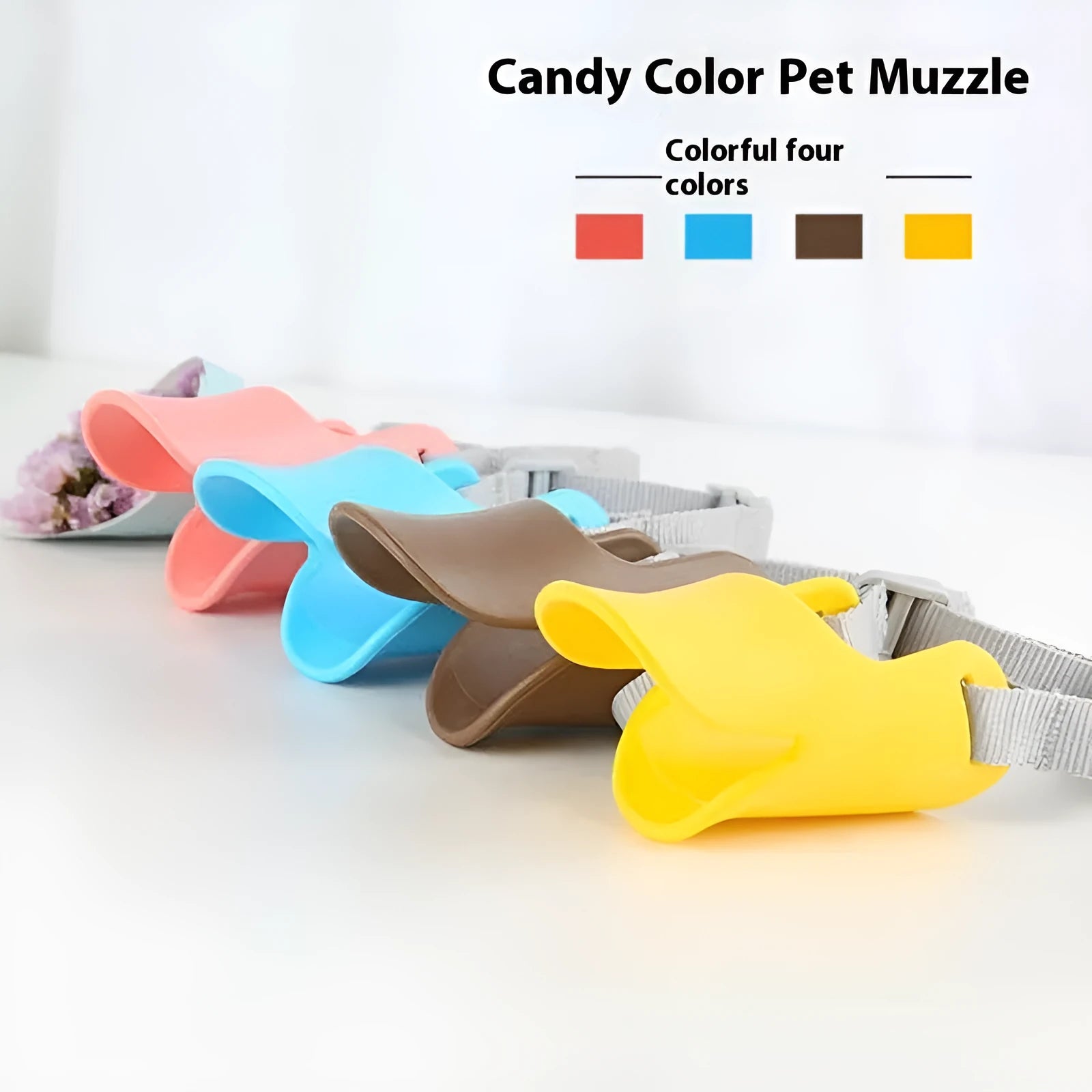 Silicone duckbilled dog muzzle in yellow on a small dog with adjustable strap