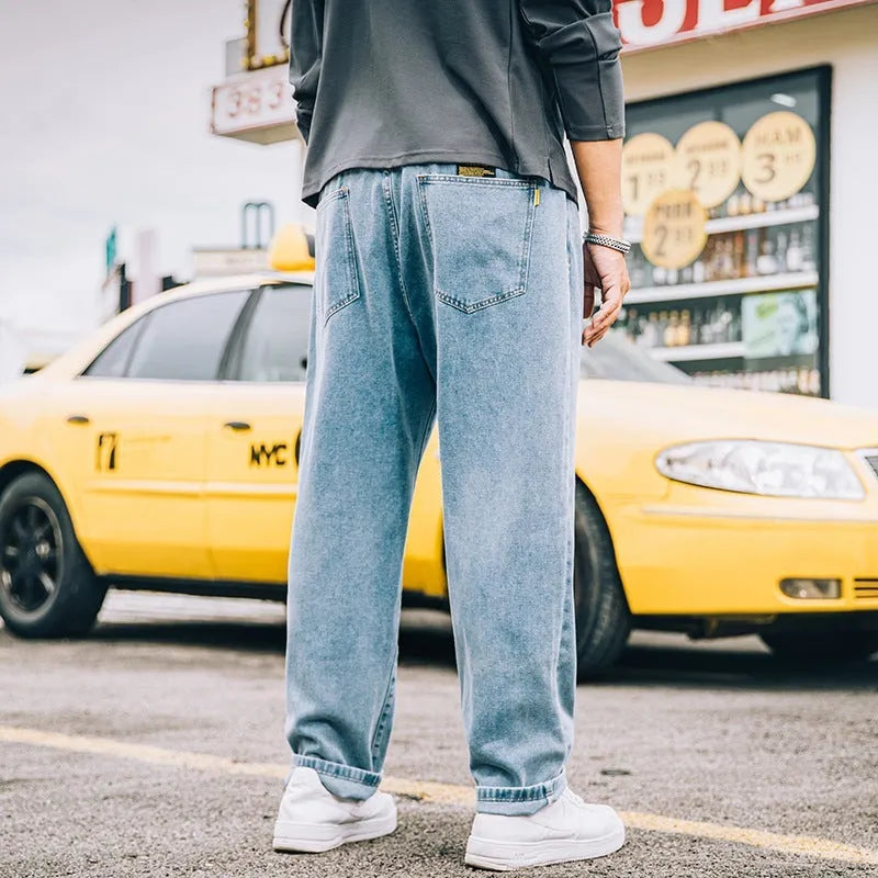 Men's loose straight jeans in dark blue cotton with zipper fly and relaxed fit