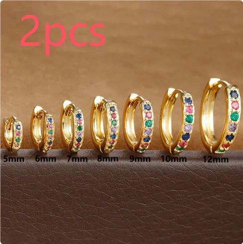 Geometric circle zircon perforated stud earrings in gold, rose gold, and silver colours showing perforated pattern detail