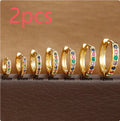 Geometric circle zircon perforated stud earrings in gold, rose gold, and silver colours showing perforated pattern detail