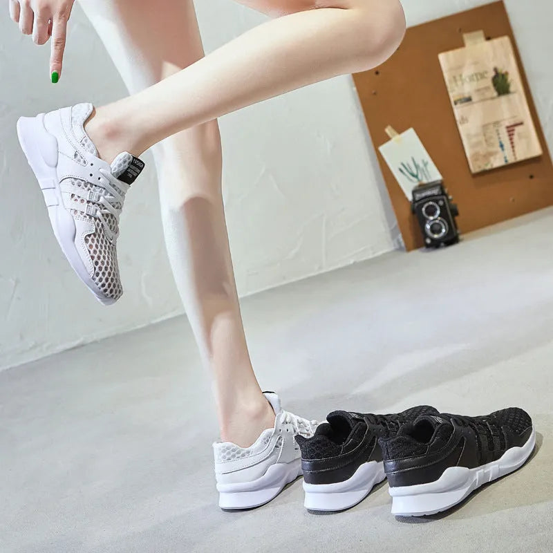 Men's low-top casual sneakers with hollow white mesh upper and round toe on a flat EVA sole.