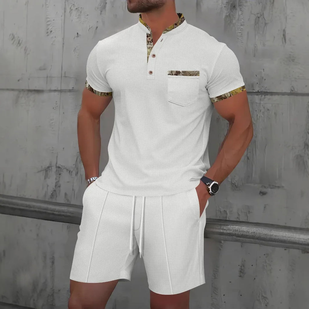 Men's grey waffle polo collar short sleeve suit top and shorts laid flat.