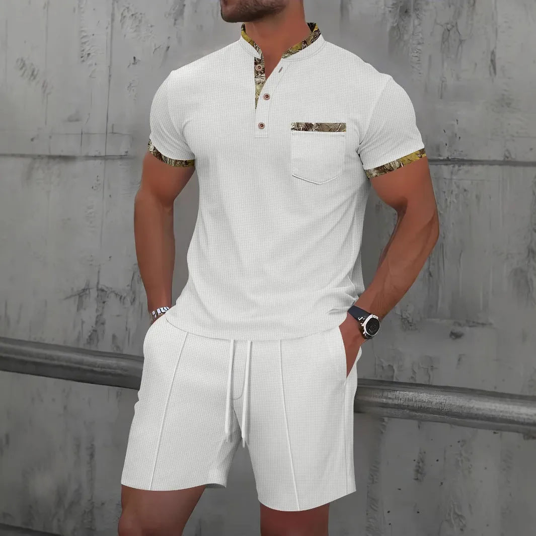 Men's grey waffle polo collar short sleeve suit top and shorts laid flat.