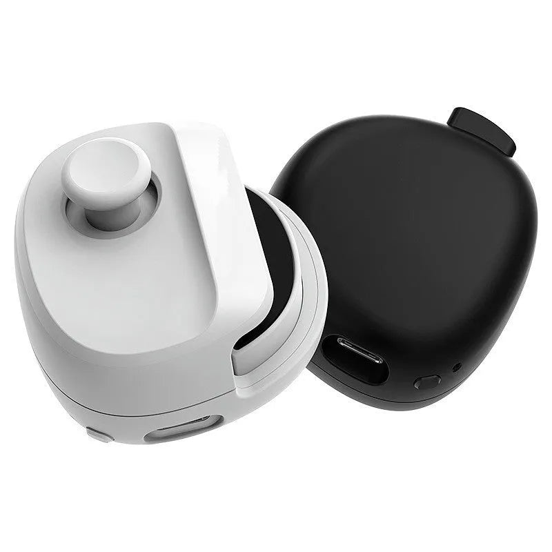 Black and white USB gaming stick controller on a desk, showing compact square design.