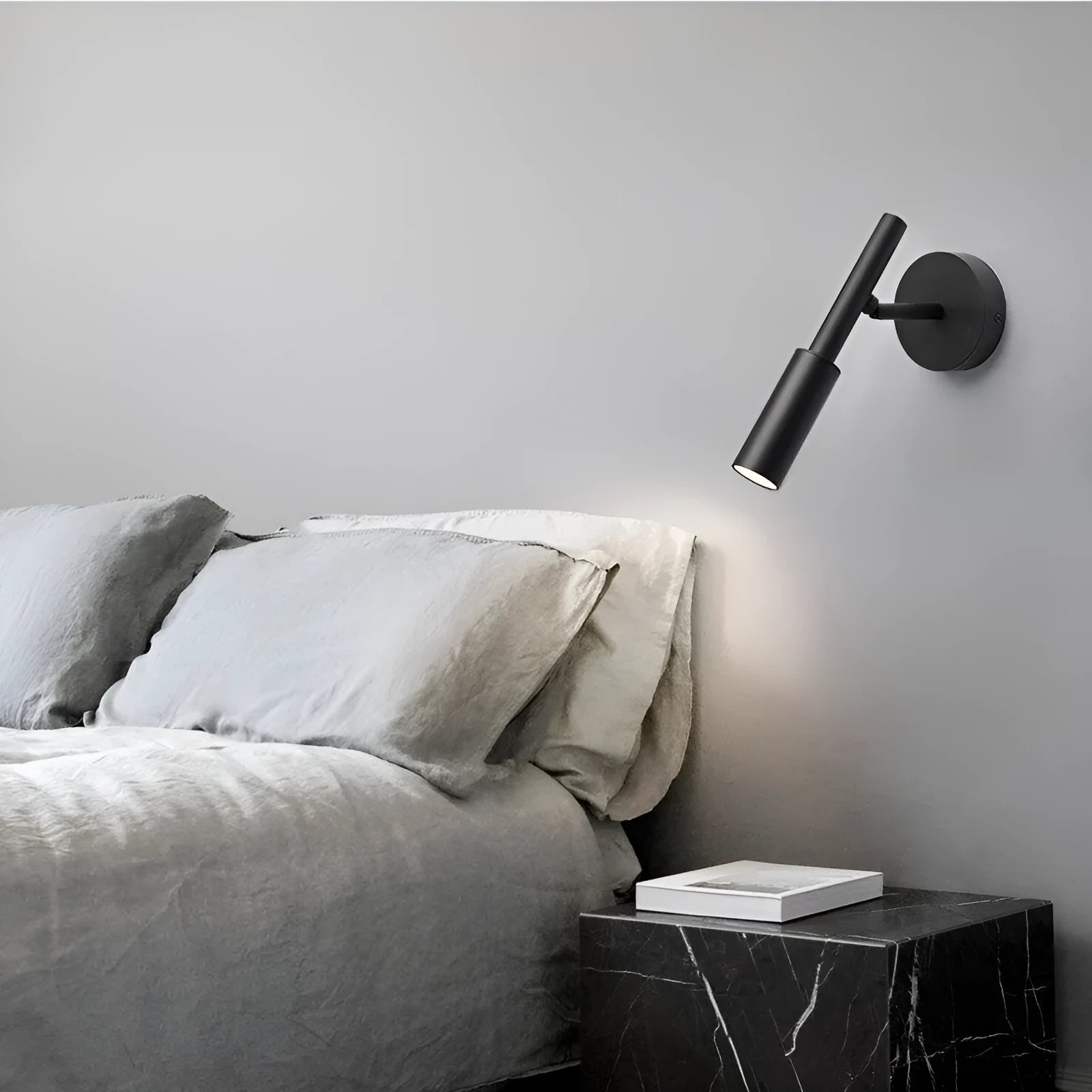 Modern minimalist wrought iron wall lamp in black or white with adjustable three-colour lighting.