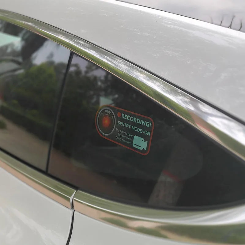 Tesla Sentry Mode warning sticker measuring 11x5 cm with electrostatic backing for window application