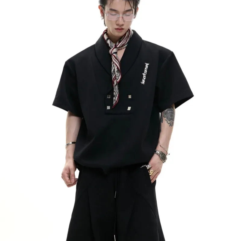 Men's dark grey cotton sports suit with metal embellishments, V-neck design, and padded shoulders