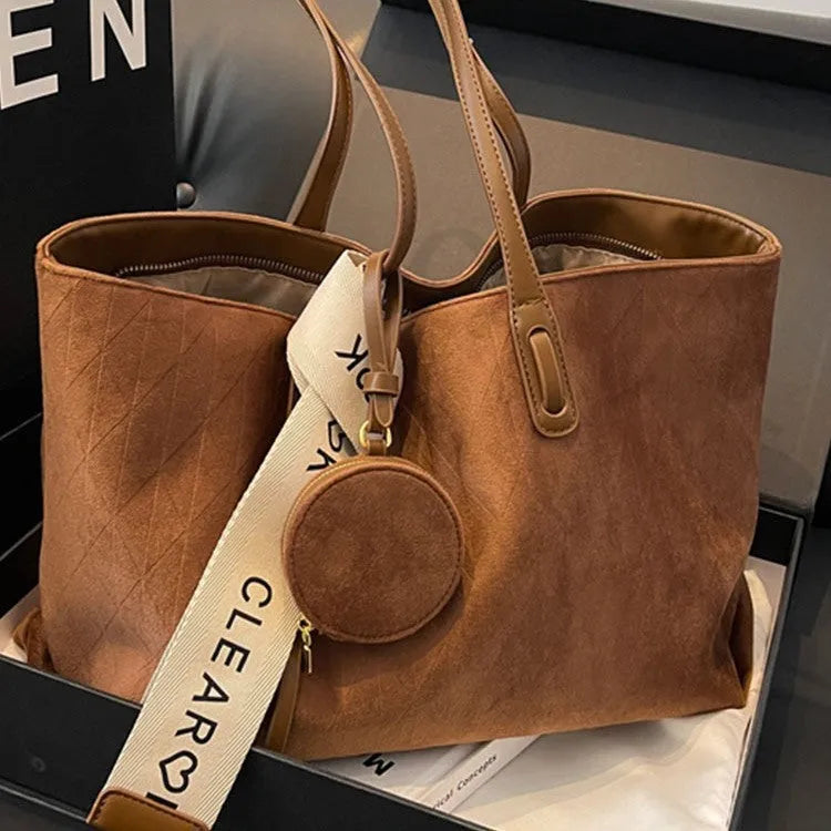 Large casual tote bag with shoulder strap in horizontal square shape with zippered internal compartment