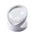 White clear plastic elevated cat food bowl with tilted anti-vomit design on a raised stand.